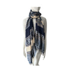 Mannequin wearing a patterned scarf on a white background