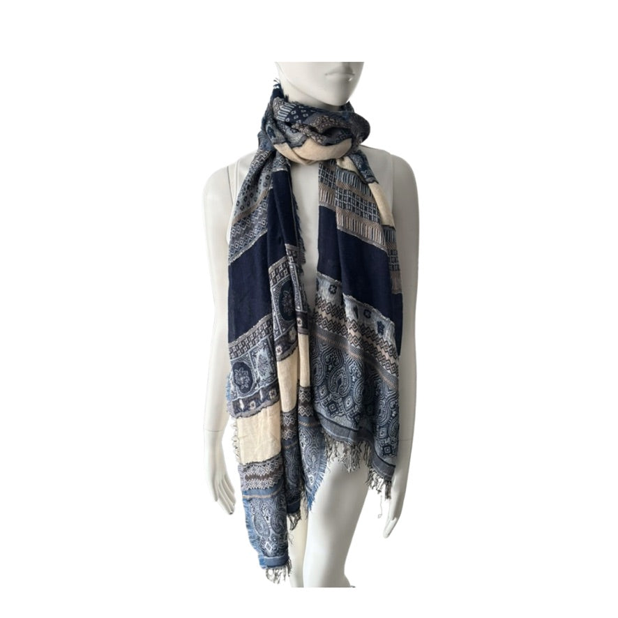 Mannequin wearing a patterned scarf on a white background