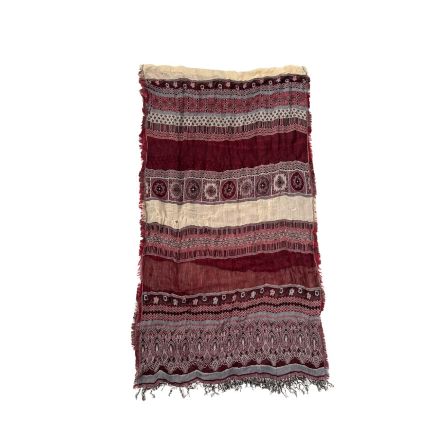 Patterned scarf with red and beige colors on a white background
