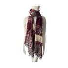 Mannequin wearing a patterned scarf on a white background