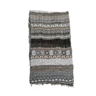 Patterned scarf with fringe on a white background