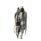 Mannequin wearing a patterned scarf on a white background