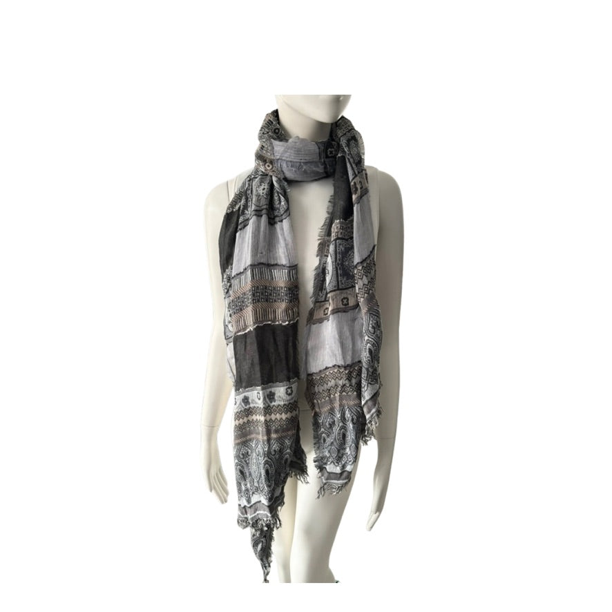 Mannequin wearing a patterned scarf on a white background