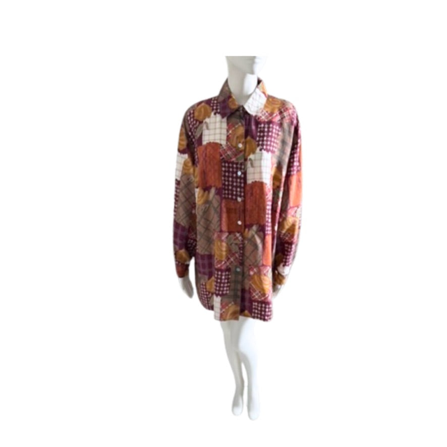 Mannequin wearing a patchwork shirt with a white background