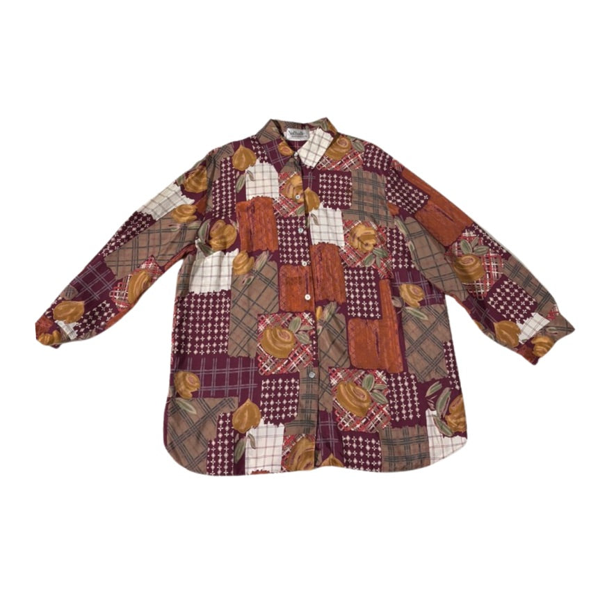 Patchwork shirt with autumnal patterns on a white background