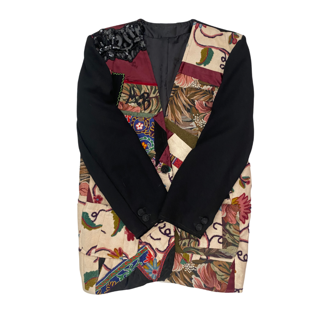 Vintage multicolour patchwork tapestry blazer with black sleeves and beaded shoulder detail, size M, laid flat.