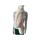 Mannequin wearing a light-colored fur scarf on a white background