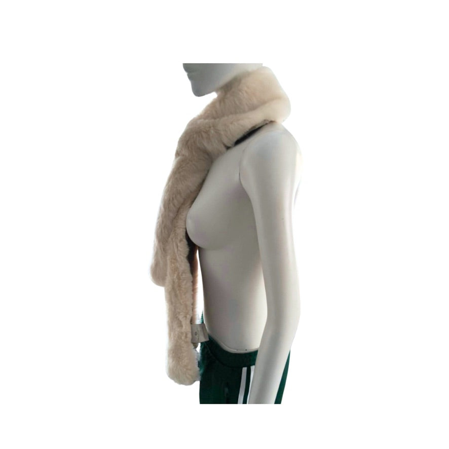 Mannequin wearing a beige fur coat on a white background