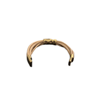 Beige leather cuff  with a hammered plate design on a white background