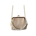 Beige handbag with pearl embellishments on a white background