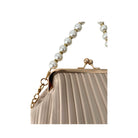 Beige handbag with pearl strap on a white background