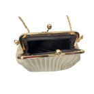 White handbag with gold frame and handle on a white background