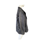 Black leather jacket on a mannequin against a white background
