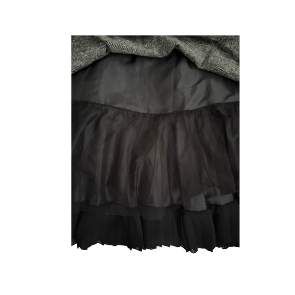 Black layered skirt with a textured fabric background