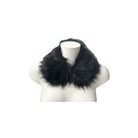 Dark green fur scarf on a mannequin against a white background