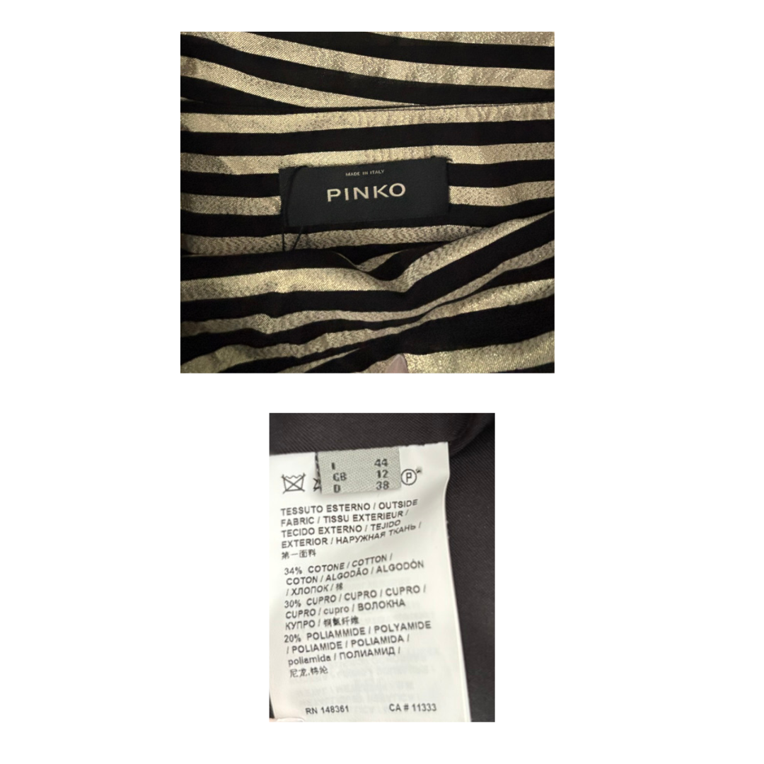 Zebra-striped garment with Pinko label and fabric composition label on a white background