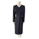 Black coat on a mannequin against a white background