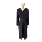 Black coat on a mannequin against a white background