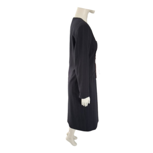 Black dress coat on a mannequin against a white background