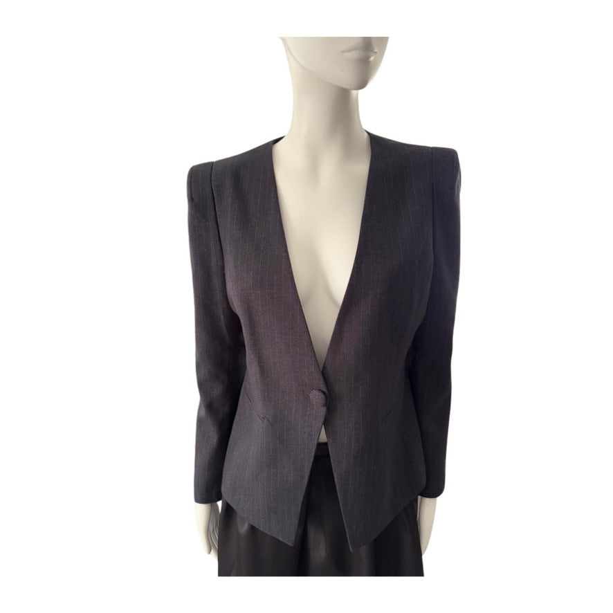 Dark gray blazer on a mannequin against a white background