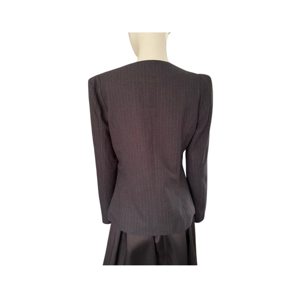 Dark gray suit jacket on a mannequin against a white background