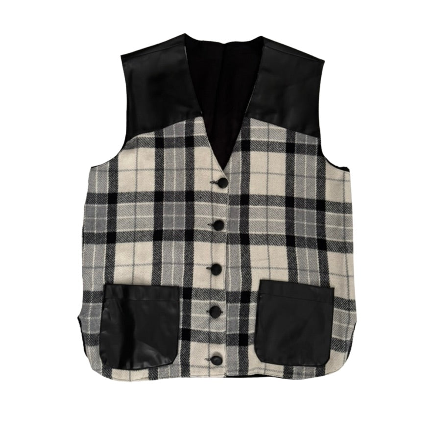 Plaid vest with black accents on a white background