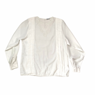 White blouse with long sleeves on a white background