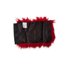 Black satin fabric with red fur trim on a white background