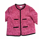 Pink textured jacket with black trim on a white background