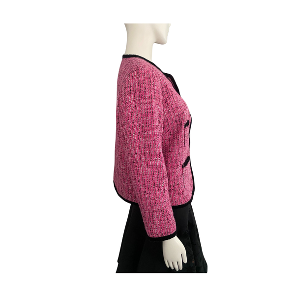 Mannequin wearing a pink textured jacket on a white background