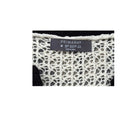 Close-up of a Primark label on a textured fabric background