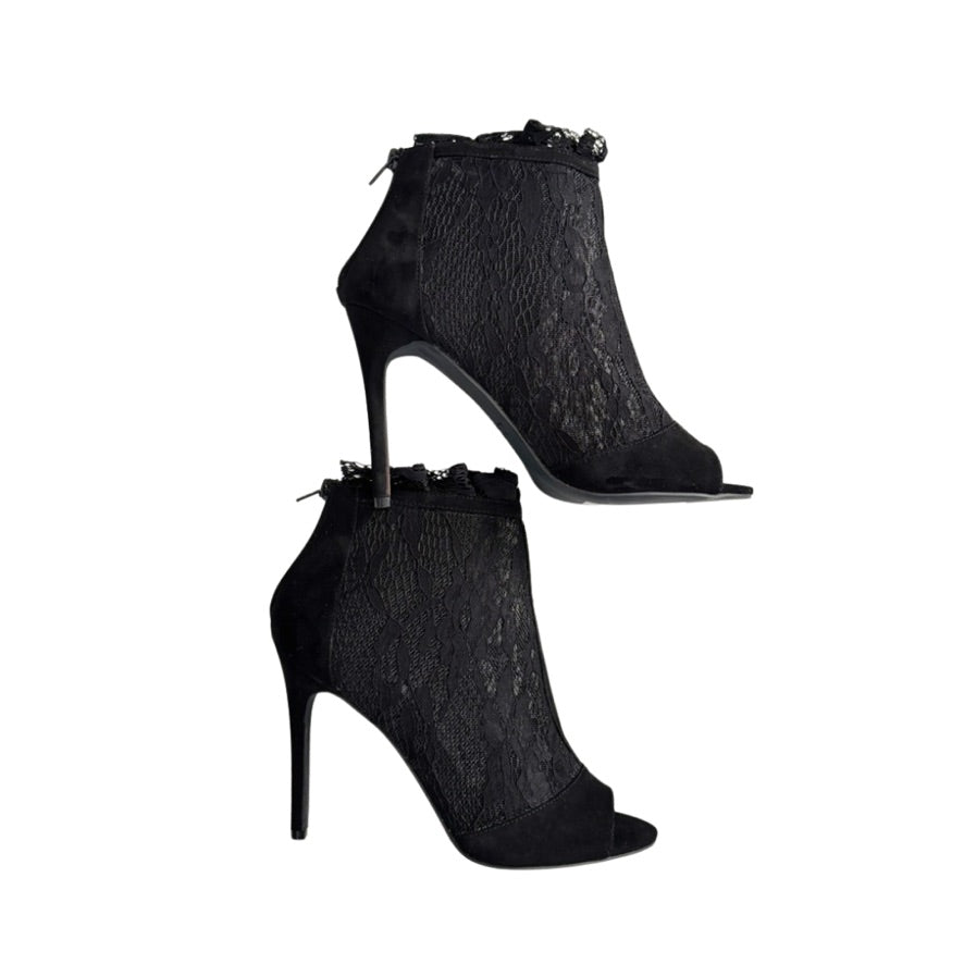 Black lace high-heeled ankle boots on a white background