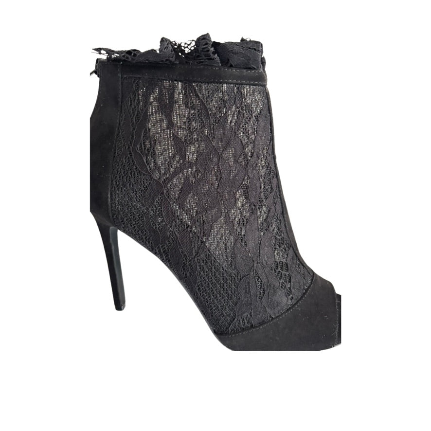 Black lace ankle boot on a white background