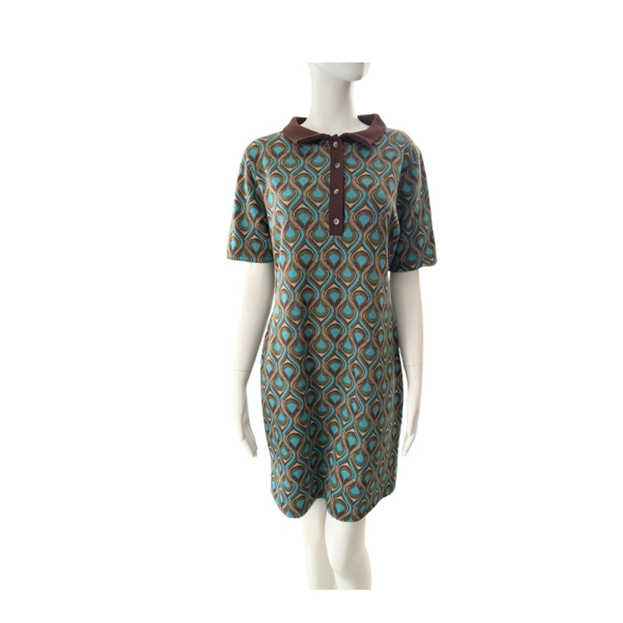 Patterned dress on a mannequin against a white background