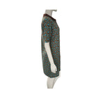 Mannequin wearing a patterned dress with a white background