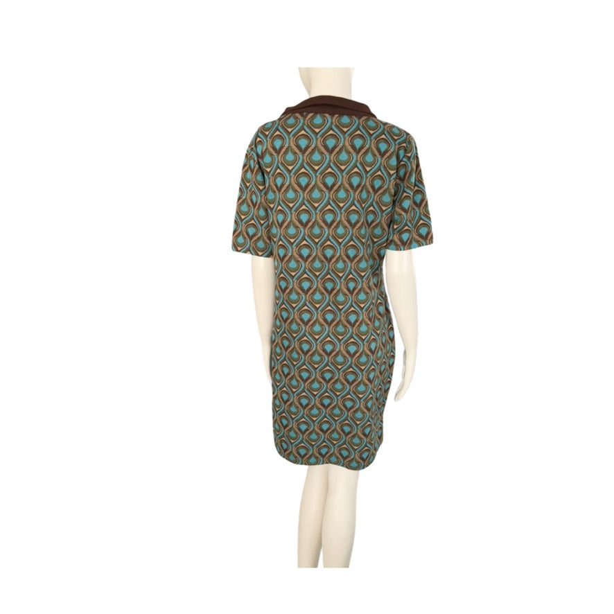 Mannequin wearing a patterned dress on a white background