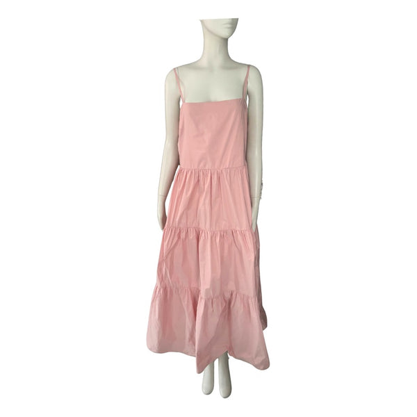 Mannequin wearing a pink dress on a white background