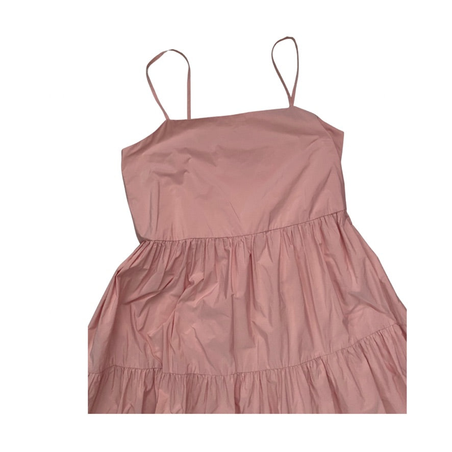 Pink dress with thin straps on a white background