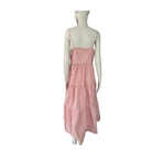 Pink dress on a mannequin against a white background