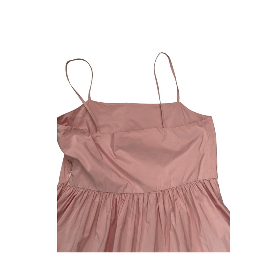 Pink spaghetti strap dress on a white background