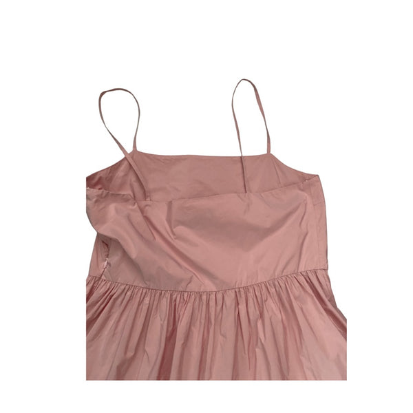 Pink spaghetti strap dress on a white background
