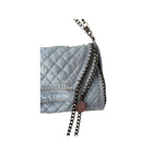 Light blue quilted handbag with a chain detail on a white background