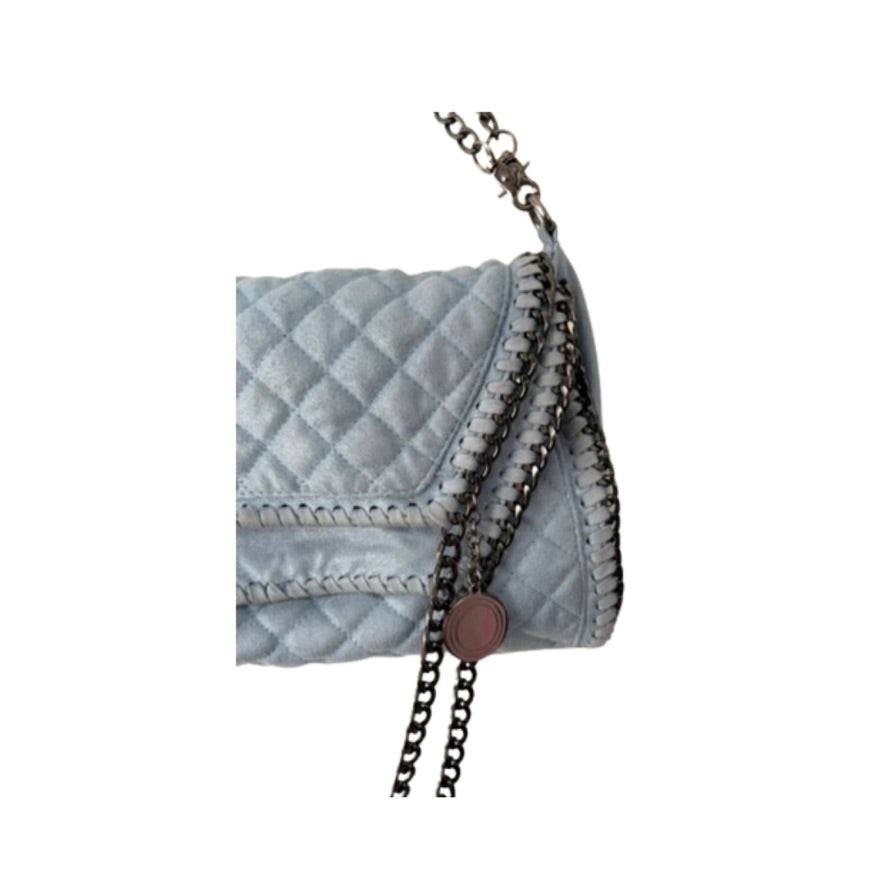 Light blue quilted handbag with a chain detail on a white background