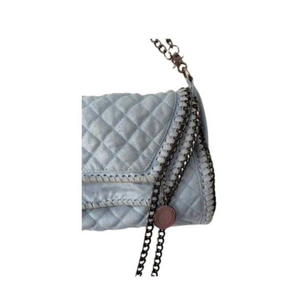 Light blue quilted handbag with a chain detail on a white background