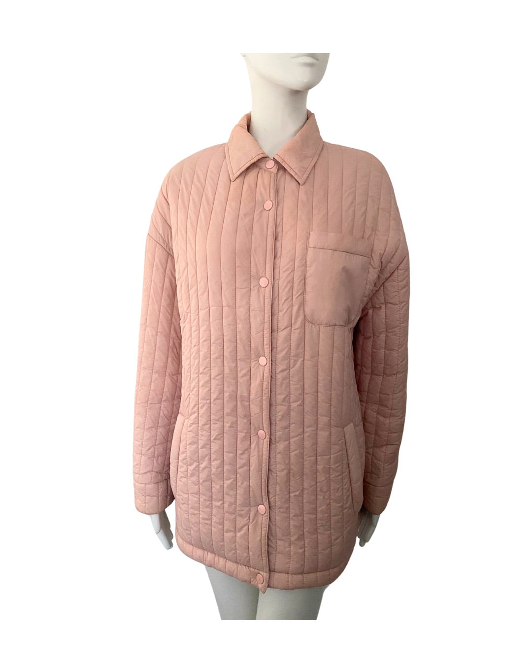 Quilted pink jacket on a mannequin against a white background