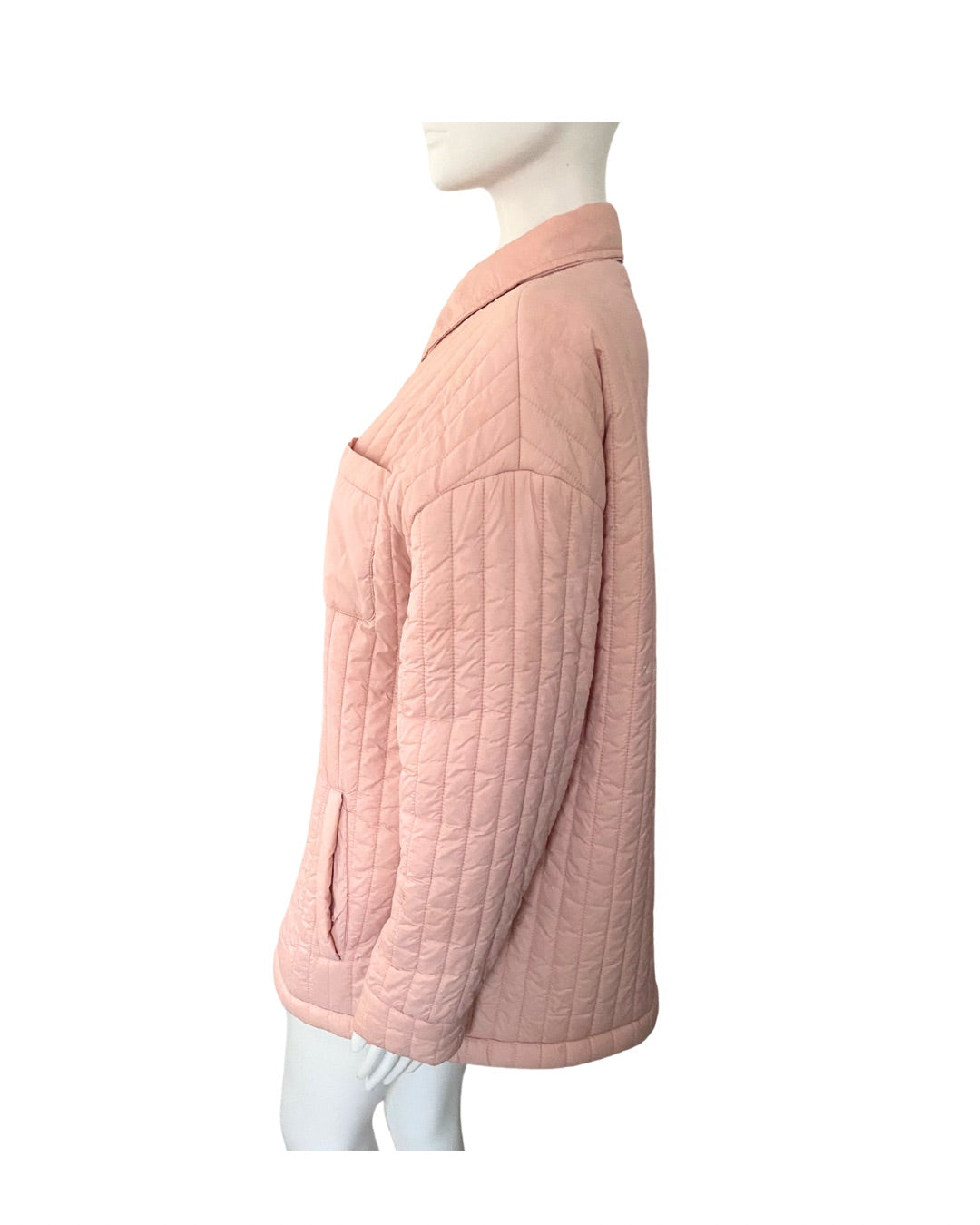 Pink quilted jacket on a mannequin against a white background