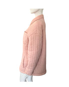 Pink quilted jacket on a mannequin against a white background