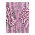 Folded pink and white striped shirt on a white background
