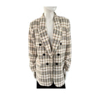 Plaid blazer on a mannequin against a white background