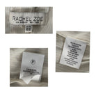 Close-up of fabric labels with 'Rachel Zoe' branding and material information.